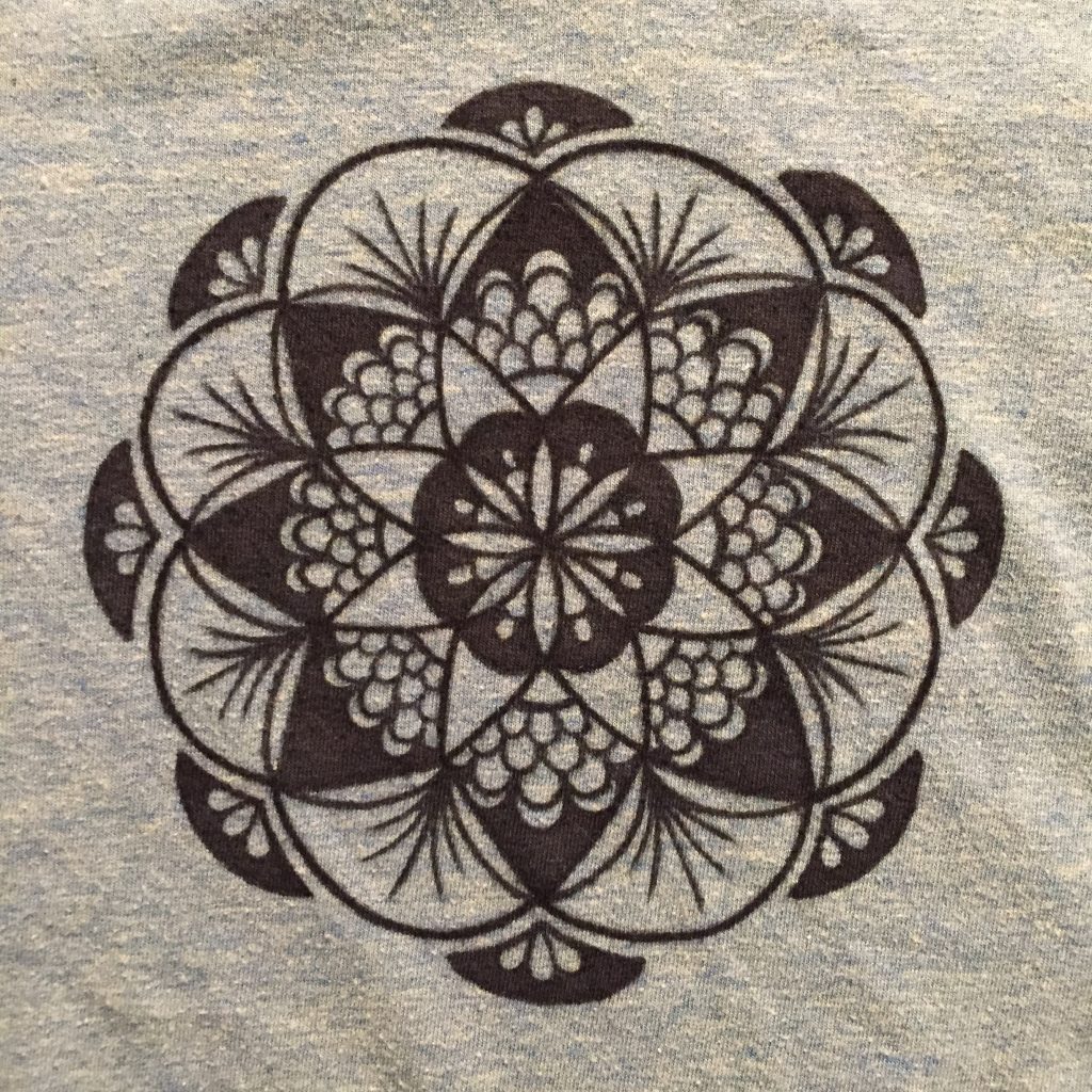 hand drawn black fan mandala on teal shirt