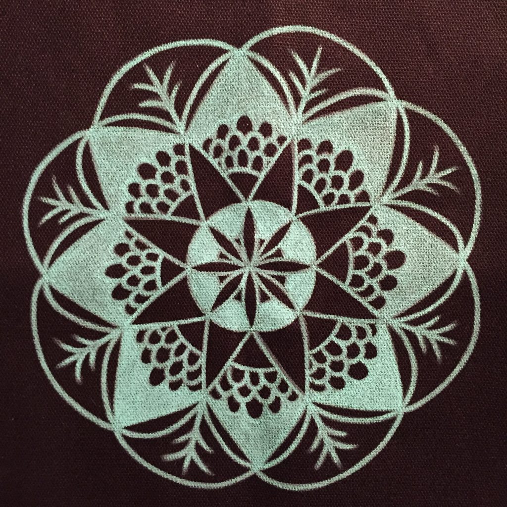hand drawn teal mandala on black canvas tote bag