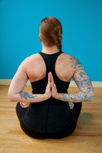 lotus posture with reverse prayer hands
