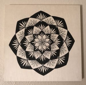 black ink pen on 12 x 12 wooden panel