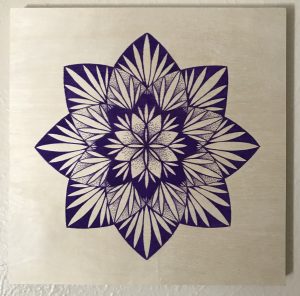 purple ink pen on 12 x 12 wooden panel